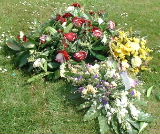 Flowers on Dick's grave a week later, after some strong Dunbar winds had turned them over several times